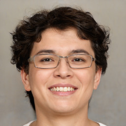 Joyful white young-adult male with medium  brown hair and brown eyes