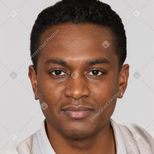 Joyful black young-adult male with short  brown hair and brown eyes