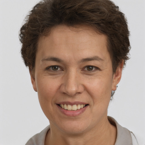 Joyful white adult female with short  brown hair and brown eyes