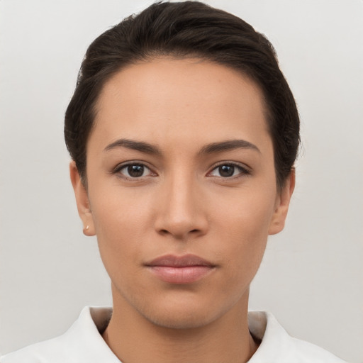 Neutral white young-adult female with short  brown hair and brown eyes