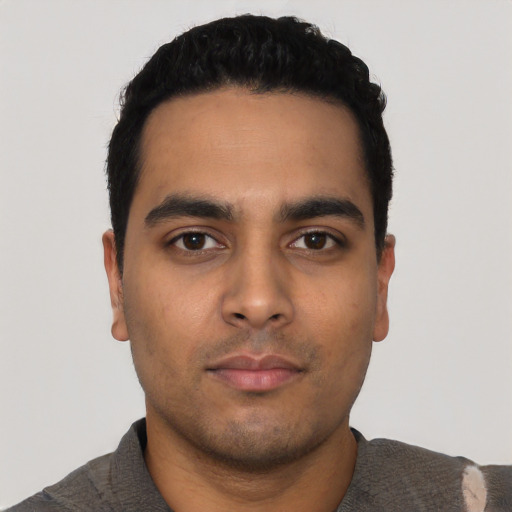 Neutral latino young-adult male with short  black hair and brown eyes