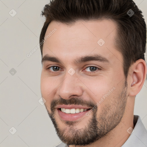 Joyful white young-adult male with short  brown hair and brown eyes