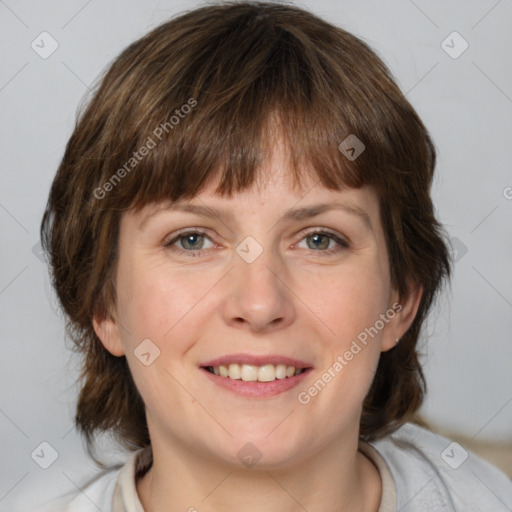 Joyful white adult female with medium  brown hair and grey eyes