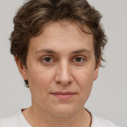 Joyful white adult female with short  brown hair and brown eyes