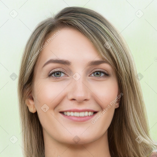 Joyful white young-adult female with long  brown hair and green eyes