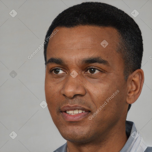 Joyful black young-adult male with short  black hair and brown eyes