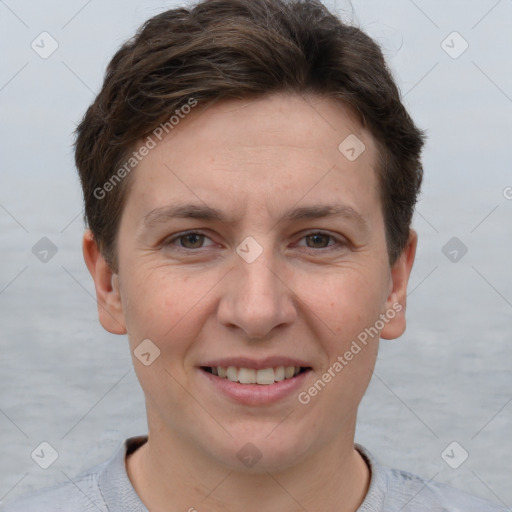 Joyful white adult female with short  brown hair and grey eyes