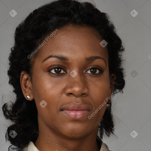 Joyful black young-adult female with long  brown hair and brown eyes