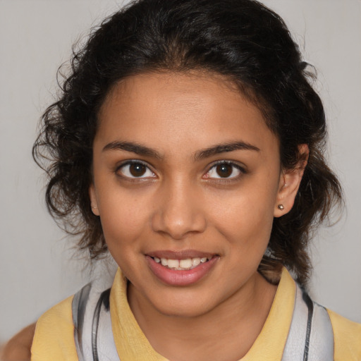 Joyful latino young-adult female with medium  brown hair and brown eyes