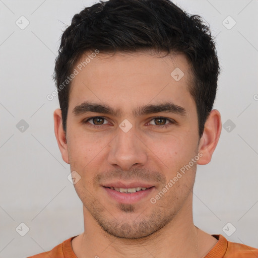 Joyful white young-adult male with short  brown hair and brown eyes