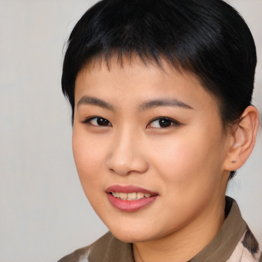 Joyful asian young-adult female with short  brown hair and brown eyes