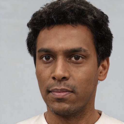 Neutral white young-adult male with short  black hair and brown eyes