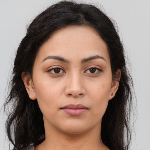 Neutral latino young-adult female with long  brown hair and brown eyes
