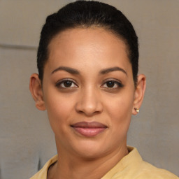 Joyful latino young-adult female with short  brown hair and brown eyes