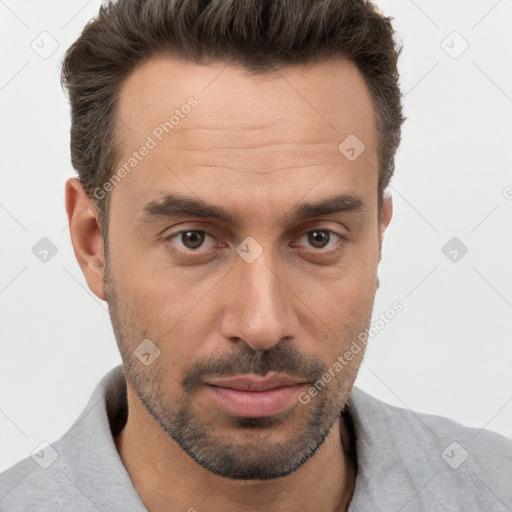 Joyful white adult male with short  brown hair and brown eyes