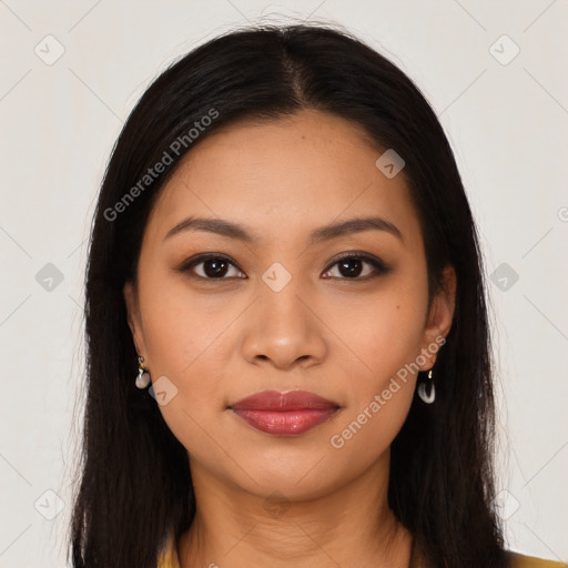 Joyful latino young-adult female with long  black hair and brown eyes