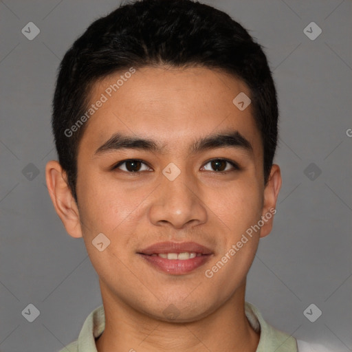 Joyful latino young-adult male with short  brown hair and brown eyes