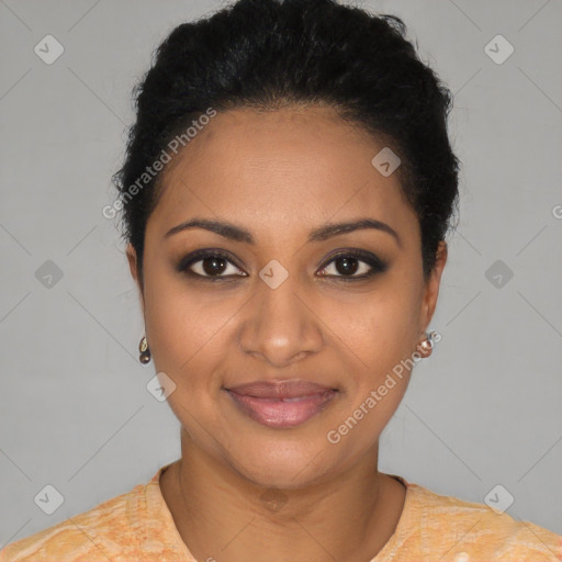 Joyful black young-adult female with short  black hair and brown eyes