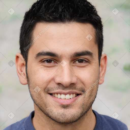 Joyful white young-adult male with short  black hair and brown eyes