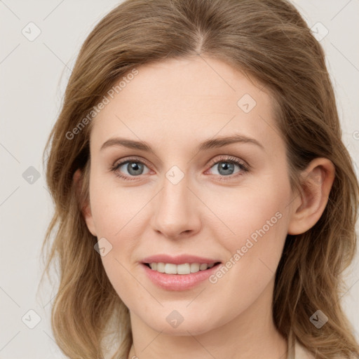 Joyful white young-adult female with medium  brown hair and blue eyes