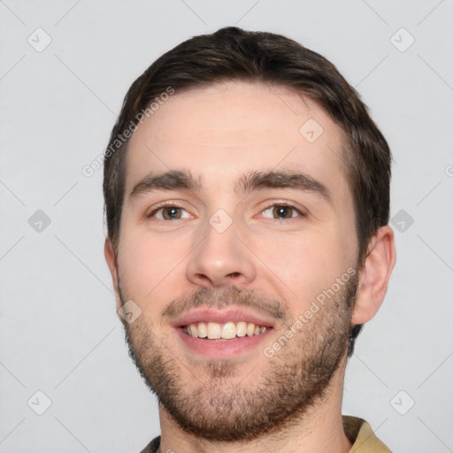 Joyful white young-adult male with short  black hair and brown eyes