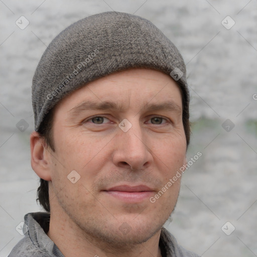 Joyful white adult male with short  brown hair and grey eyes