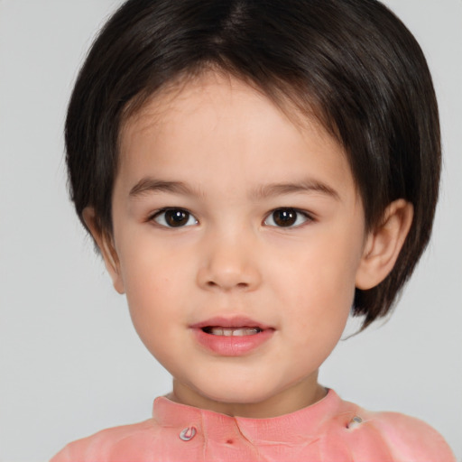 Joyful white child female with short  brown hair and brown eyes