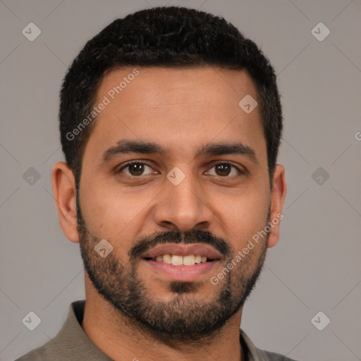 Joyful latino young-adult male with short  brown hair and brown eyes