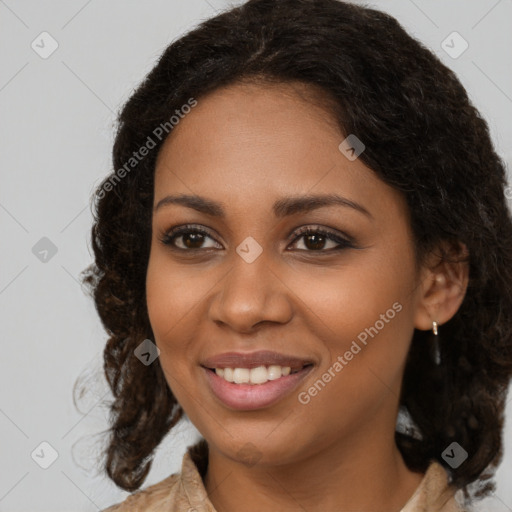 Joyful black young-adult female with medium  brown hair and brown eyes