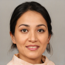 Joyful white young-adult female with medium  brown hair and brown eyes