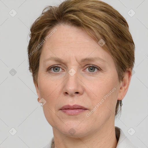 Joyful white adult female with short  brown hair and grey eyes