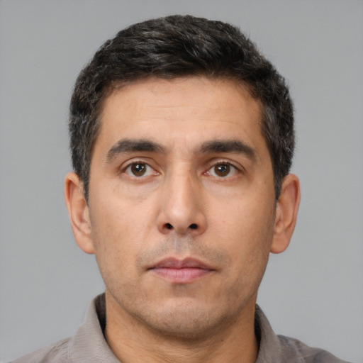 Neutral white young-adult male with short  black hair and brown eyes