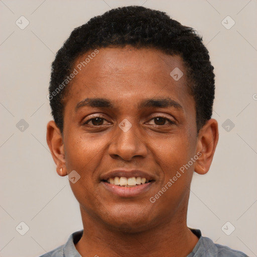 Joyful black young-adult male with short  black hair and brown eyes