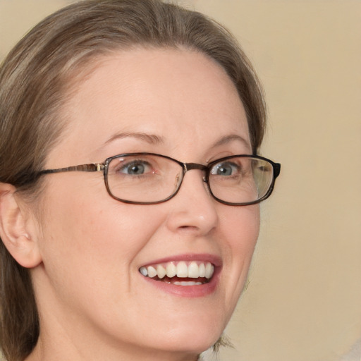 Joyful white adult female with medium  brown hair and green eyes