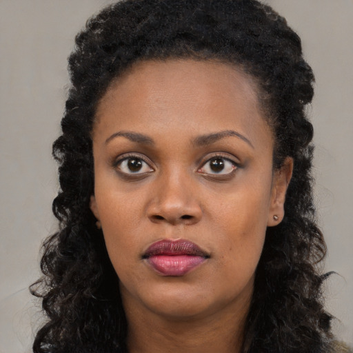 Neutral black young-adult female with long  black hair and brown eyes