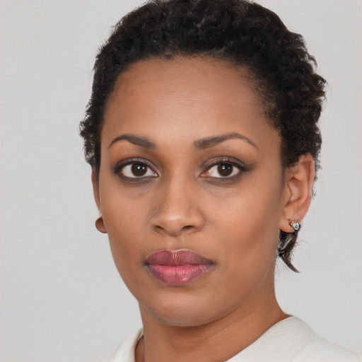 Neutral black young-adult female with short  brown hair and brown eyes