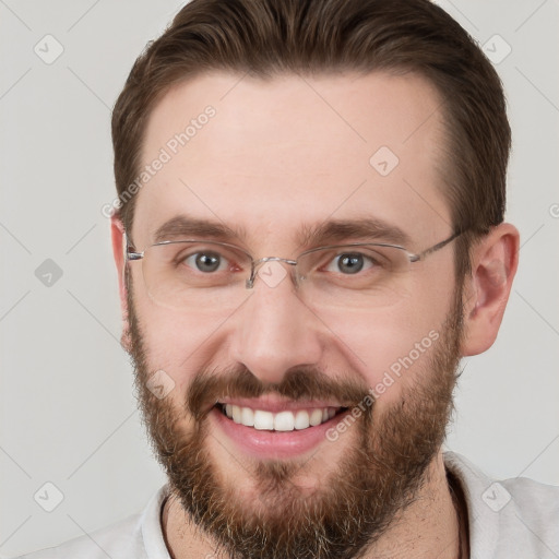 Joyful white adult male with short  brown hair and grey eyes