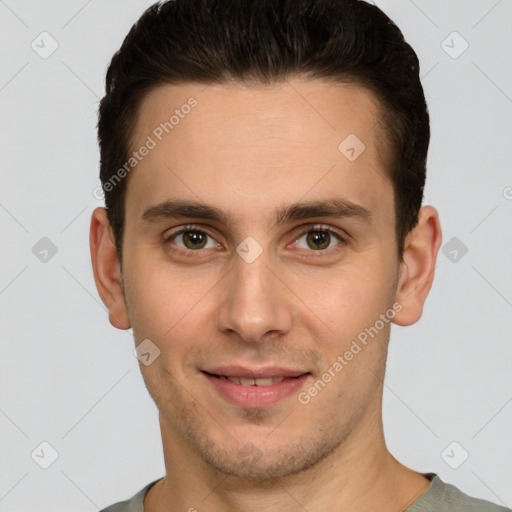 Joyful white young-adult male with short  brown hair and brown eyes