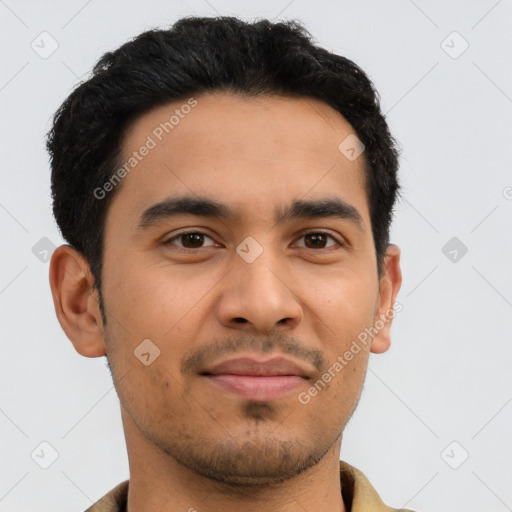 Joyful latino young-adult male with short  black hair and brown eyes