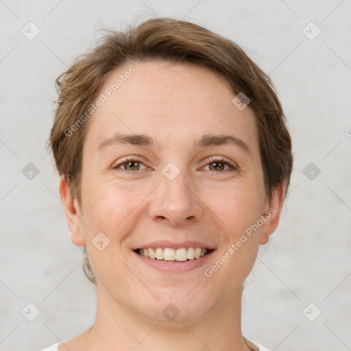 Joyful white young-adult female with short  brown hair and grey eyes