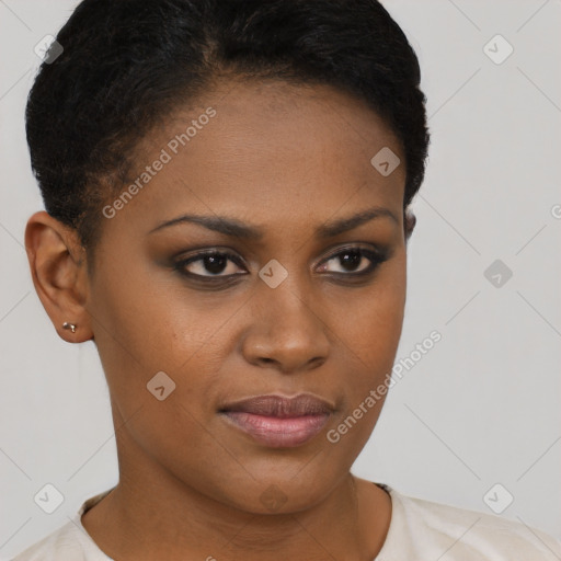 Joyful black young-adult female with short  brown hair and brown eyes