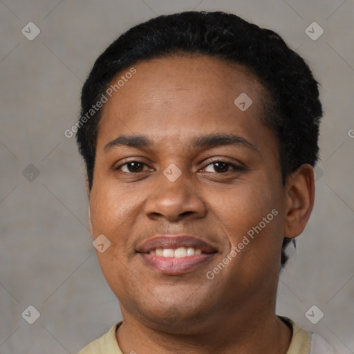 Joyful black young-adult male with short  black hair and brown eyes