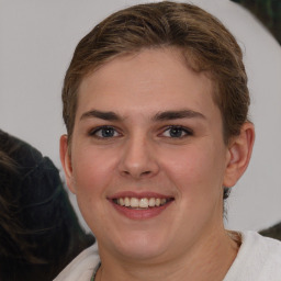 Joyful white young-adult female with medium  brown hair and grey eyes