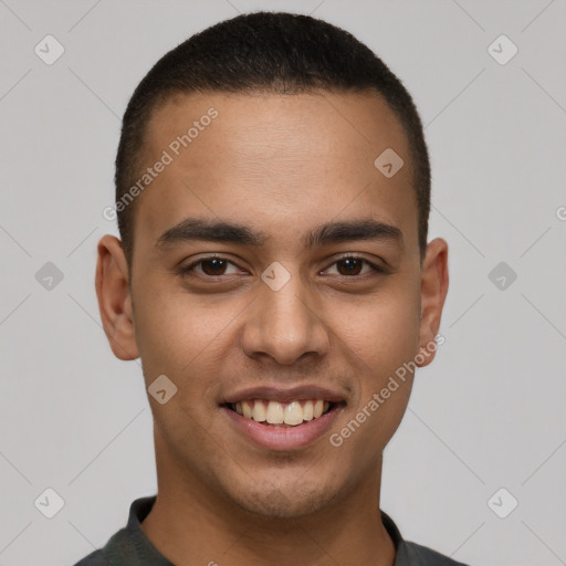 Joyful latino young-adult male with short  brown hair and brown eyes