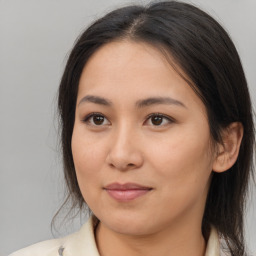 Joyful asian young-adult female with medium  brown hair and brown eyes