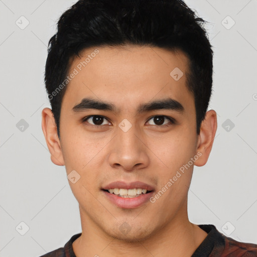 Joyful asian young-adult male with short  black hair and brown eyes