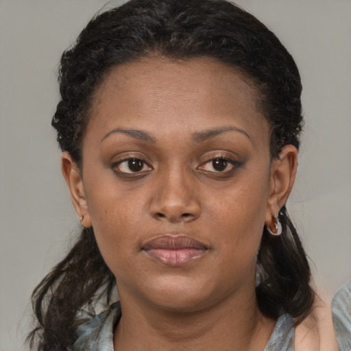 Neutral black young-adult female with medium  brown hair and brown eyes