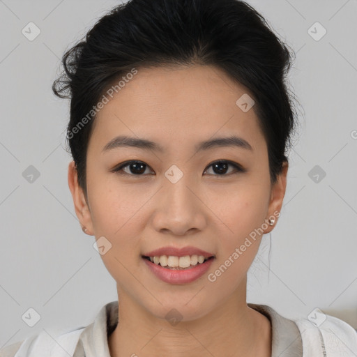 Joyful asian young-adult female with short  black hair and brown eyes