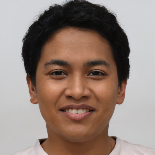 Joyful asian young-adult female with short  black hair and brown eyes