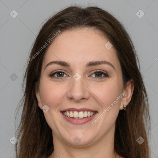 Joyful white young-adult female with long  brown hair and grey eyes